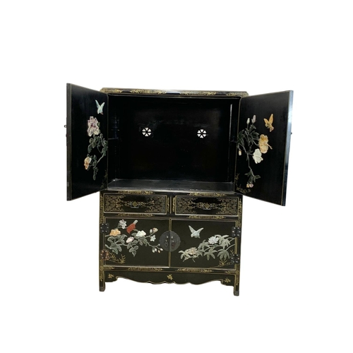 1084 - A large Chinese lacquered cabinet with 2 drawers. 96.5 x 55.5 x 138cm.