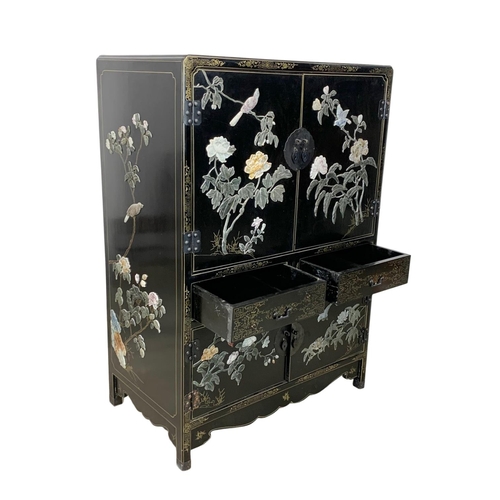 1084 - A large Chinese lacquered cabinet with 2 drawers. 96.5 x 55.5 x 138cm.