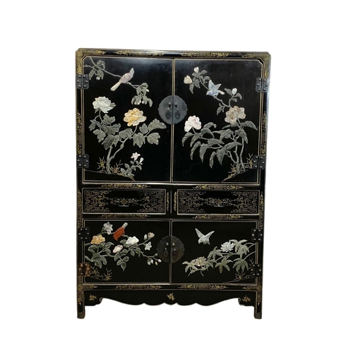 1084 - A large Chinese lacquered cabinet with 2 drawers. 96.5 x 55.5 x 138cm.