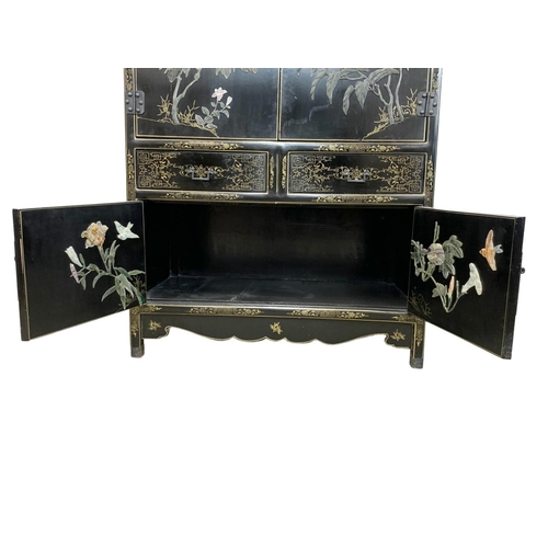 1084 - A large Chinese lacquered cabinet with 2 drawers. 96.5 x 55.5 x 138cm.