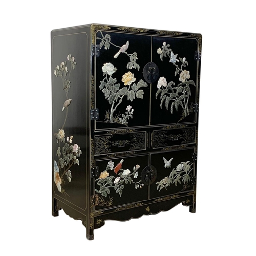 1084 - A large Chinese lacquered cabinet with 2 drawers. 96.5 x 55.5 x 138cm.