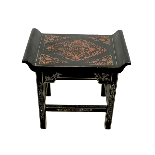 1085 - A Chinese lacquered stool. 46 x 29.5 x 43cm.