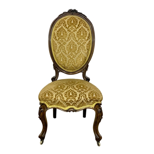 1086 - A Victorian carved walnut side chair. Circa 1860.