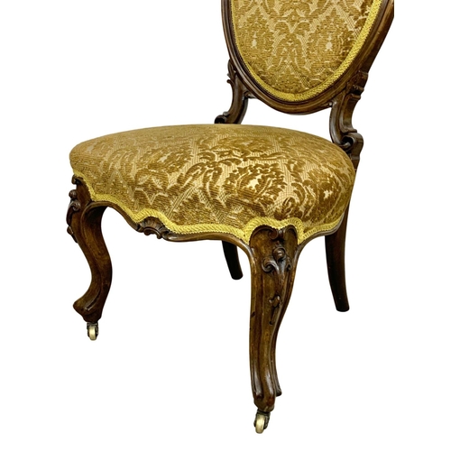 1086 - A Victorian carved walnut side chair. Circa 1860.