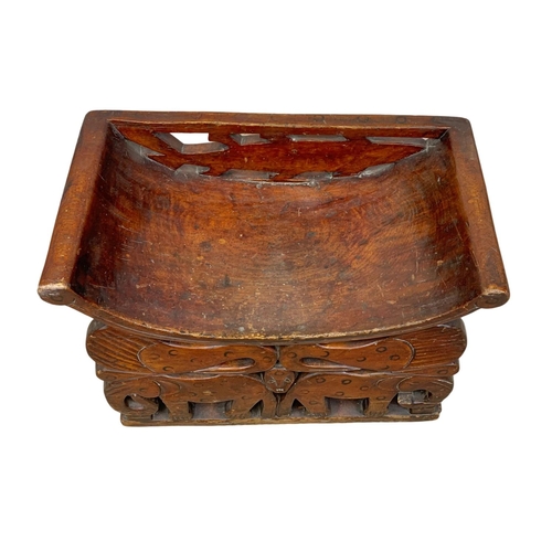 1087 - A vintage African carved stool. 56 x 30 x 43.5cm