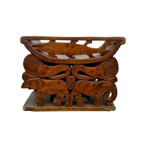 1087 - A vintage African carved stool. 56 x 30 x 43.5cm