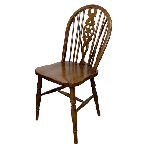 1088 - A set of 6 beech wheel back chairs.