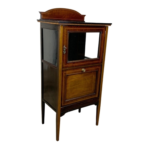 1090 - An Edwardian inlaid mahogany music cabinet. 53.5 x 36.5 x 112.5cm