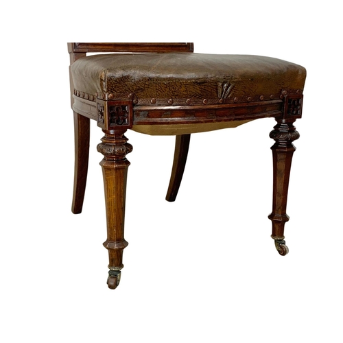 1091 - A late Victorian carved oak side chair with original leather back and seat. In the Neo Gothic style ... 