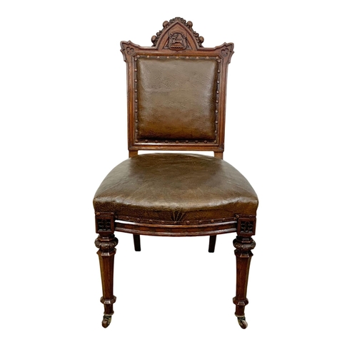 1091 - A late Victorian carved oak side chair with original leather back and seat. In the Neo Gothic style ... 