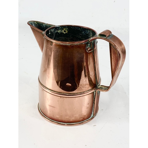 11 - A good quality Victorian copper jug. V.R. Quart. 18 x 16cm.