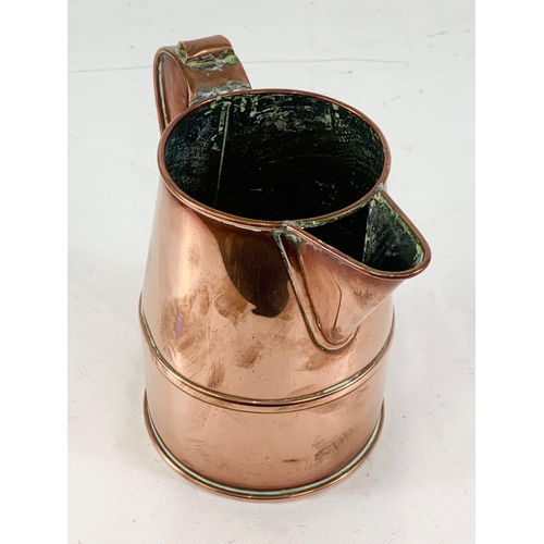 11 - A good quality Victorian copper jug. V.R. Quart. 18 x 16cm.