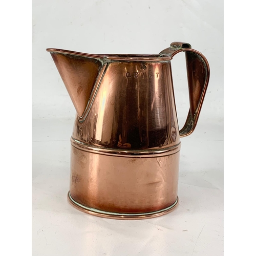 11 - A good quality Victorian copper jug. V.R. Quart. 18 x 16cm.