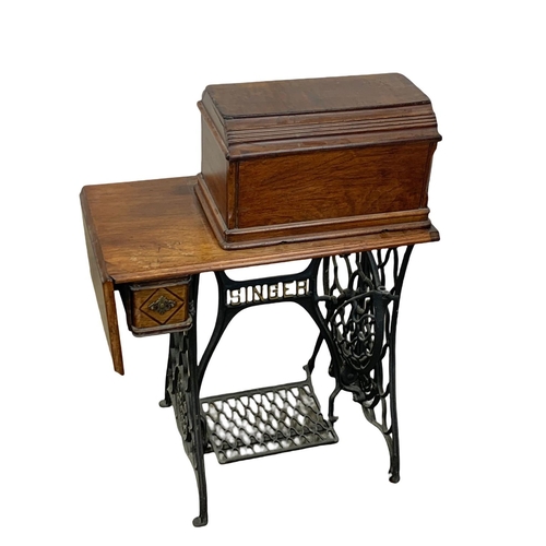 1110 - An early 20th century Singer sewing machine table. 75 x 41 x 105cm