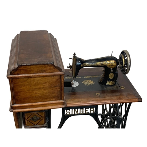 1110 - An early 20th century Singer sewing machine table. 75 x 41 x 105cm