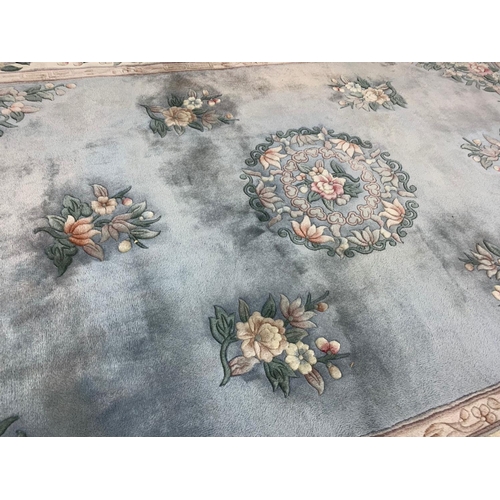 1113 - A large Chinese wool rug 183 x 300cm