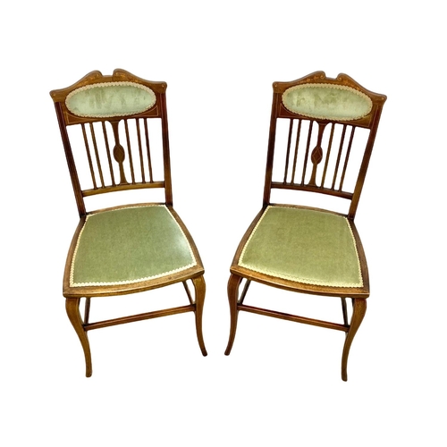 1116 - A pair of Edwardian inlaid mahogany side chairs.