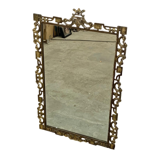 1119 - An ornate brass and onyx hall table and matching mirror. Mirror measures 51.5 x 82.5cm