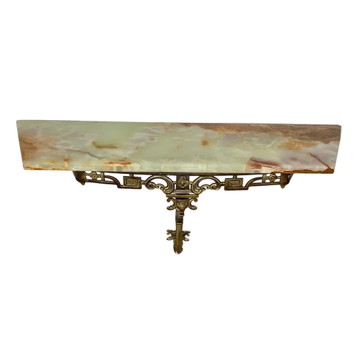 1119 - An ornate brass and onyx hall table and matching mirror. Mirror measures 51.5 x 82.5cm