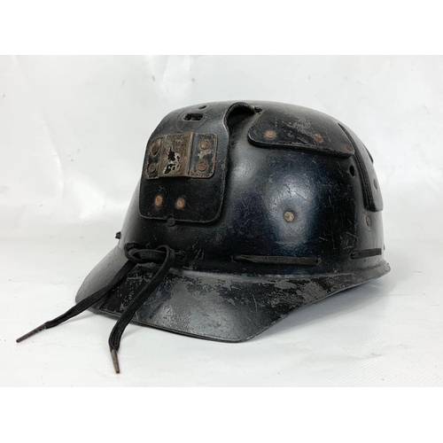 112 - A vintage miners helmet and a miners Oxygen Self Rescue Device.