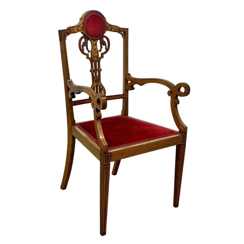 1124 - An Edwardian inlaid mahogany armchair.