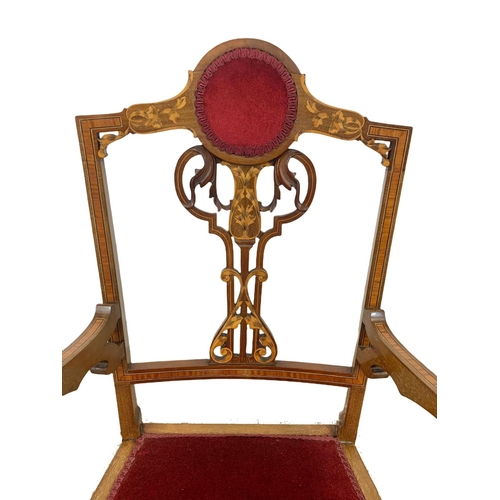 1124 - An Edwardian inlaid mahogany armchair.