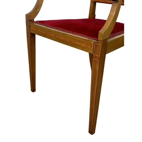 1124 - An Edwardian inlaid mahogany armchair.