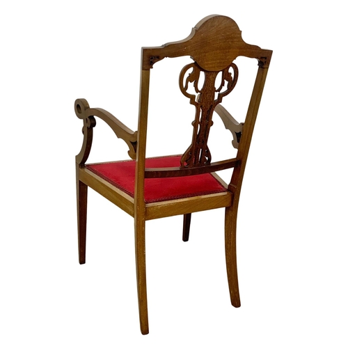 1124 - An Edwardian inlaid mahogany armchair.