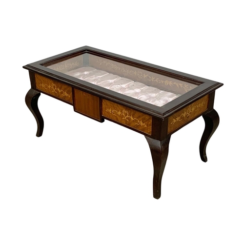 1126 - An inlaid display table. 95 x 48 x 45.5cm