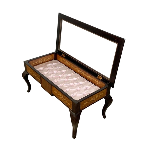 1126 - An inlaid display table. 95 x 48 x 45.5cm