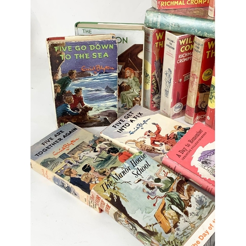 114 - A collection of vintage books. Including 17 William books by Richmal Crompton, 5 “Famous Five” books... 