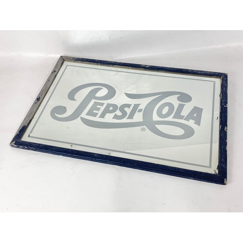 117 - A 1970’s Pepsi-Cola mirror. 64.5 x 44cm.