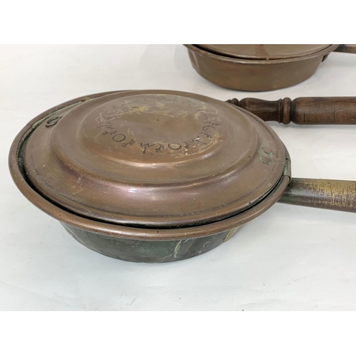 118 - 3 Victorian copper bed pans. Largest measures 116cm.