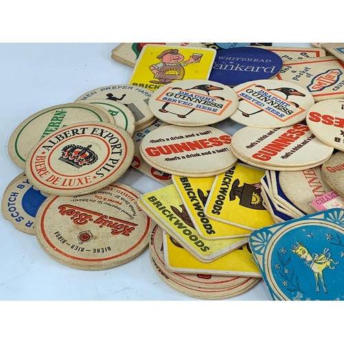 120 - A large quantity of vintage beer coasters.