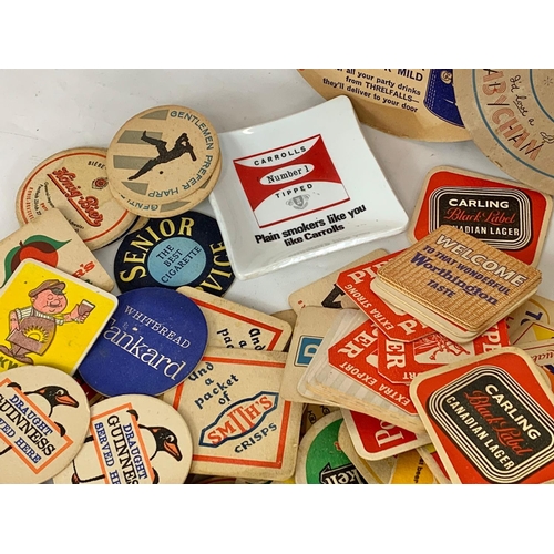 120 - A large quantity of vintage beer coasters.