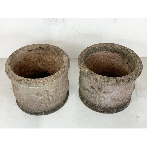 124 - A pair large concrete garden planters. 39 x 30cm.