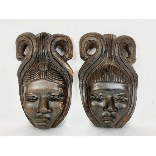 13 - A pair of early 20th century African wall hangings. Circa 1900. 23 x 36cm