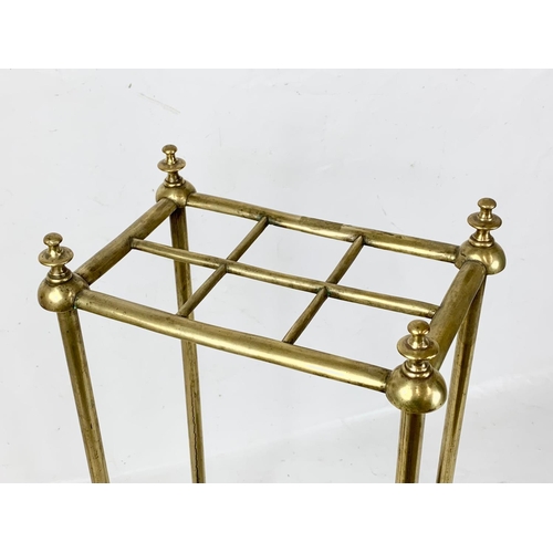 130 - A Victorian brass and cast iron umbrella stick stand. 31 x 20 x 62cm