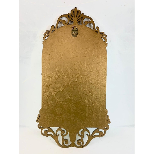 131 - A vintage ornate gilt framed bevelled mirror. 45 x 83cm.