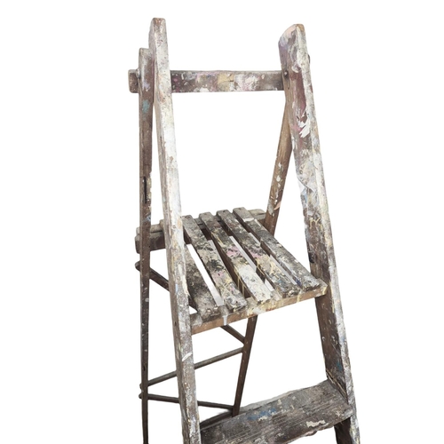 134 - A vintage wooden step ladder. 183cm