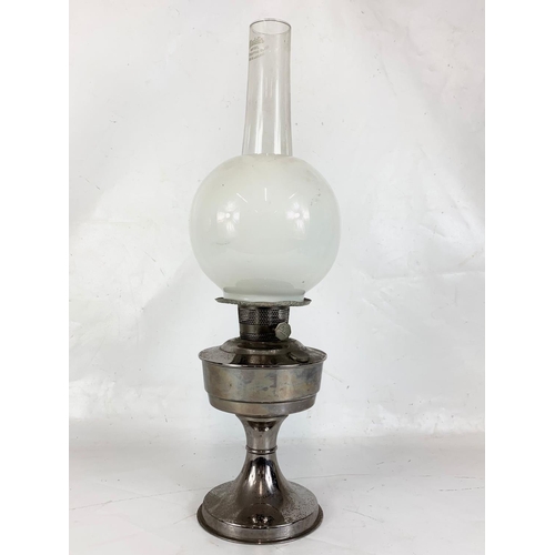 14 - A vintage oil lamp. 60cm