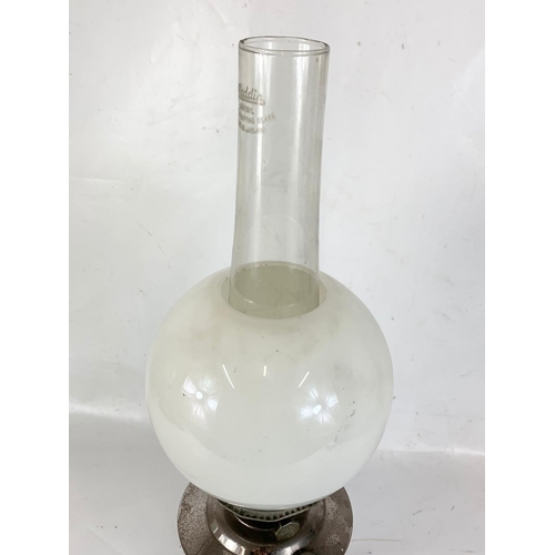 14 - A vintage oil lamp. 60cm