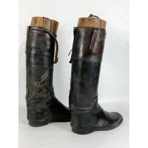 140 - A pair of large late Victorian leather riding boots. 32 x 52cm.