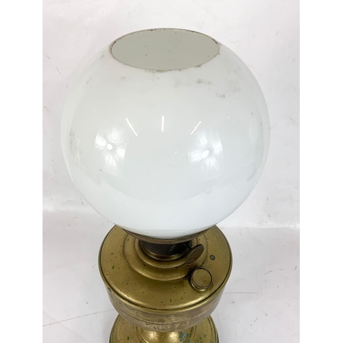 15 - A vintage brass oil lamp. 45cm.