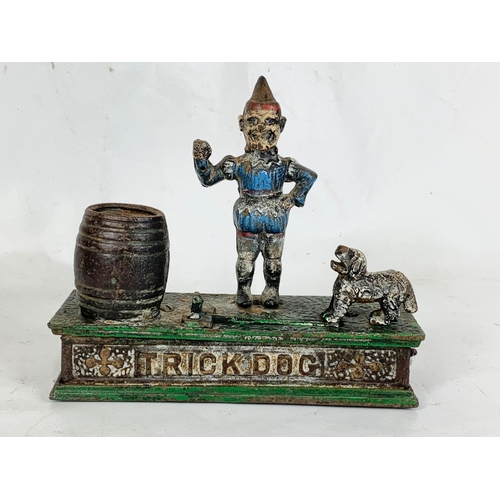 150 - 4 old style cast iron money boxes. Largest 29cm.