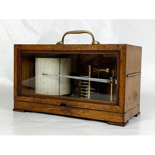 155 - An Edwardian period Barograph in an oak case. 29 x 13 x 17cm.