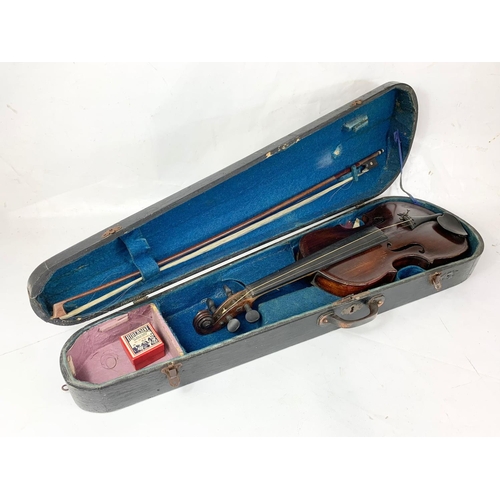 16 - A late 19th century violin in case. Case measures 79cm.