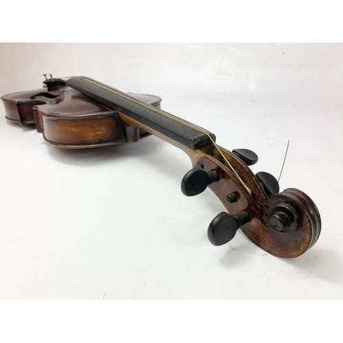 16 - A late 19th century violin in case. Case measures 79cm.