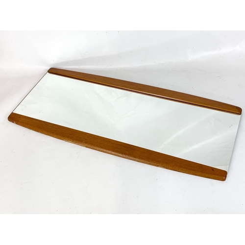 164 - A Mid Century teak framed mirror. 78.5 x 35.5cm.