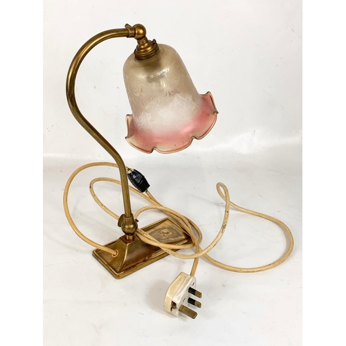 166 - A vintage brass swan neck adjustable lamp with glass shade. 35cm.